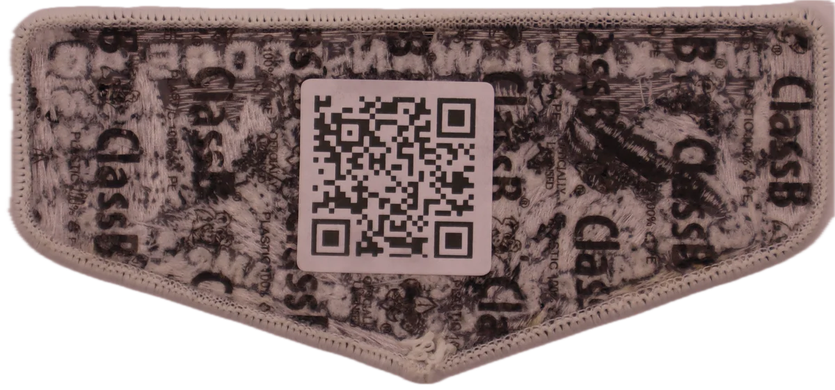 images/2025_legend_of_the_makajabear_glow_in_the_dark_lodge_flap_rear.webp